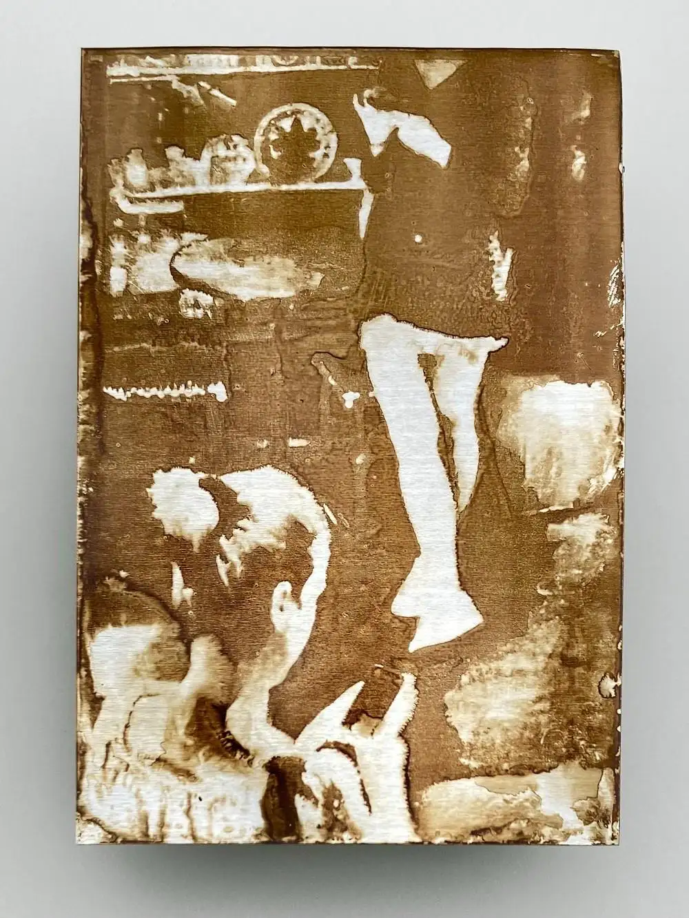 Heliography “Two Women with Phones”, created in May 2018 at 149 Rue Saint-Dominique, Paris. Handcrafted on aluminum with Niépce’s original 1822–1827 process using Bitume de Judée. Unique collector’s artwork.
