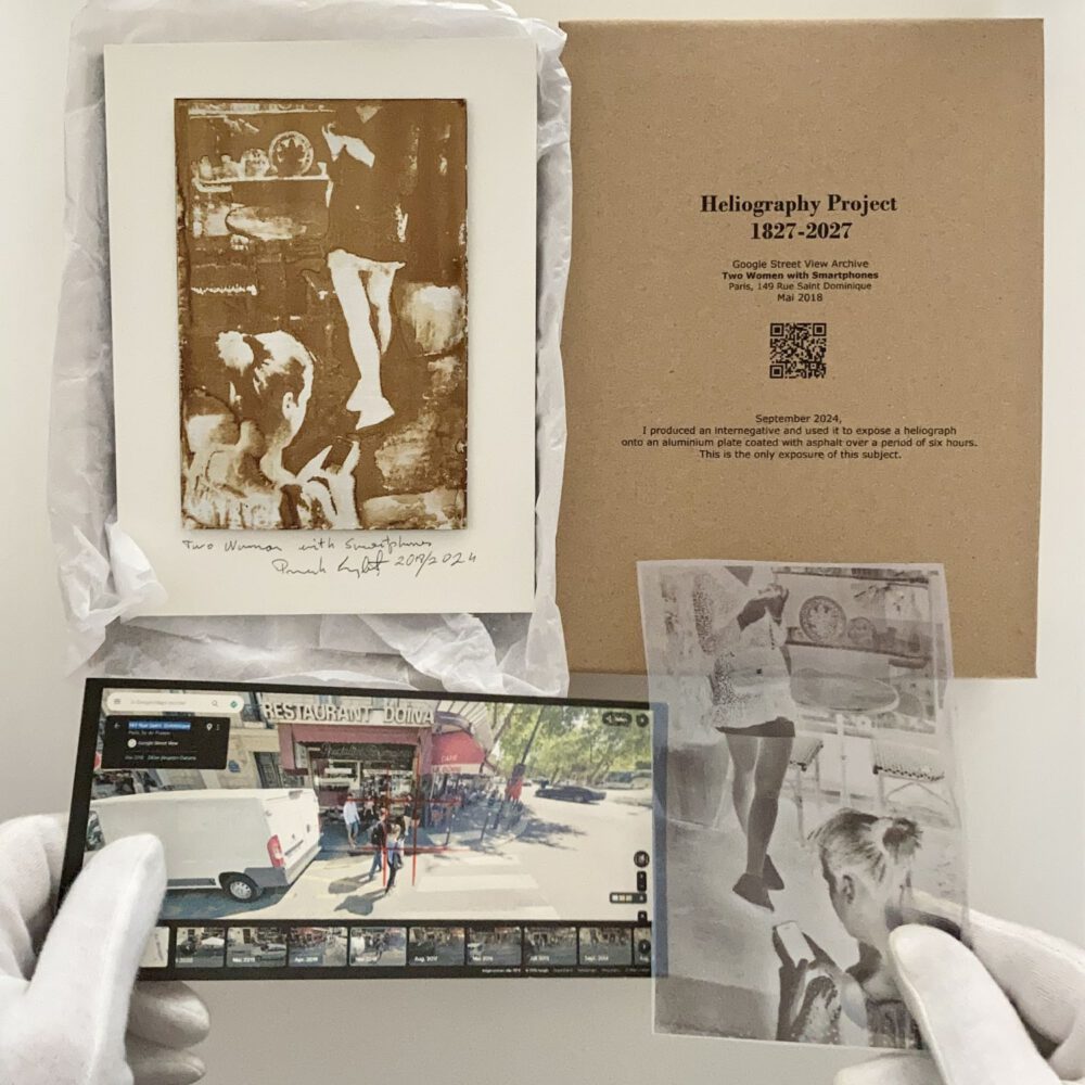 heliography-paris-149-Rue-Saint-Dominique-mai-2018 Heliography “Two Women with Phones”, created in May 2018 at 149 Rue Saint-Dominique, Paris. Handcrafted on aluminum with Niépce’s original 1822–1827 process using Bitume de Judée. Unique collector’s artwork.